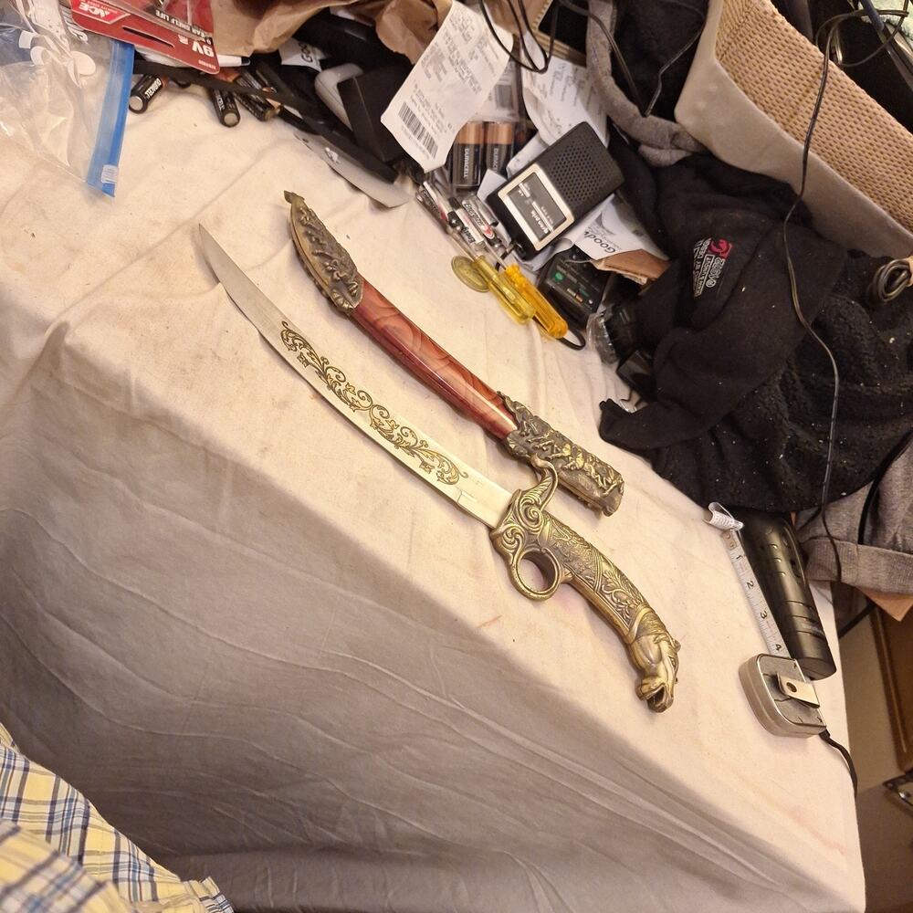 Ornate Decorative Dagger With Horse Head Pommel And Engraved Blade.